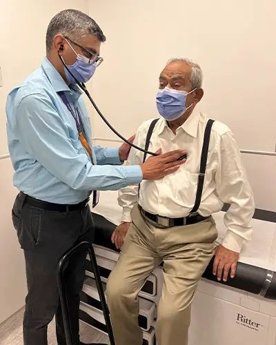 Walter having his heartbeat checked by doctor