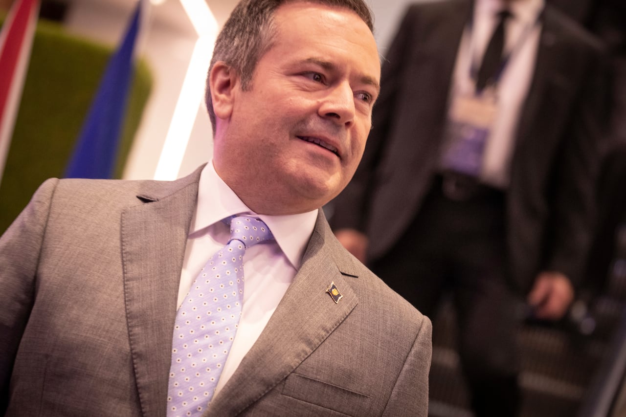 A man wearing a grey suit.