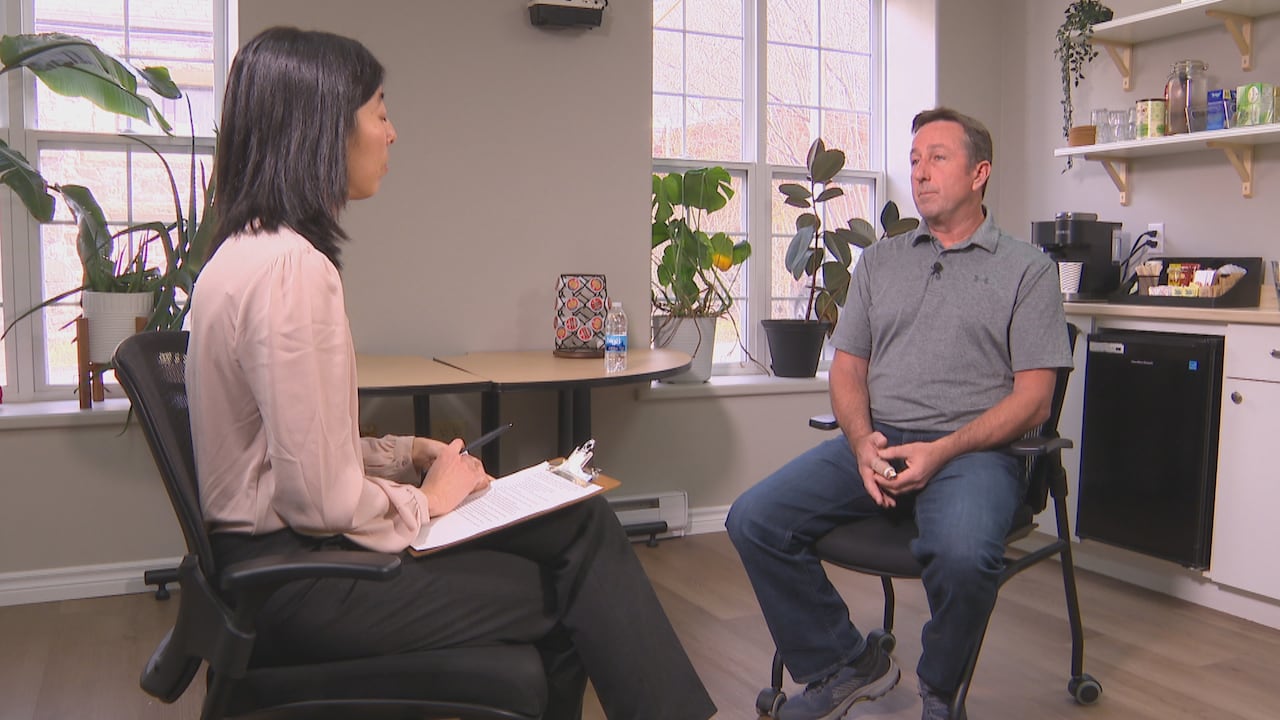 A man and a woman conduct an interview.