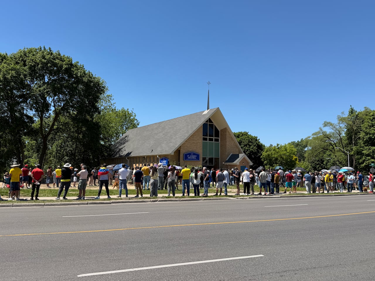 People lined up on a sidewalk