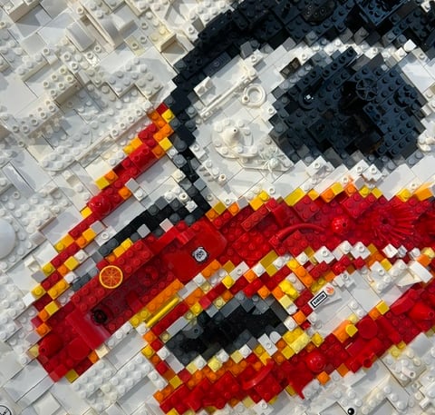 Red, orange, white and black Lego bricks.