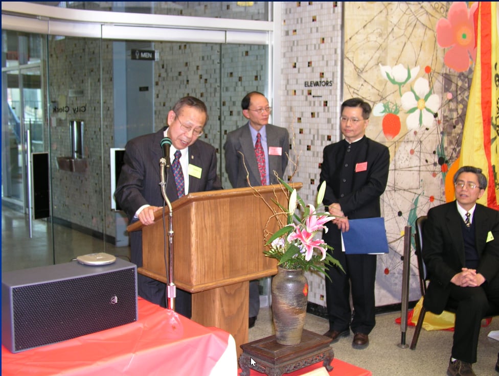 picture of men near a podium