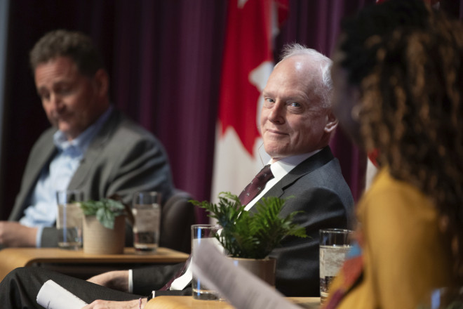 Deputy Minister David Morrison on stage with Chief Transformation Officer Antoine Chevrier and Host Bénite Mandaka.