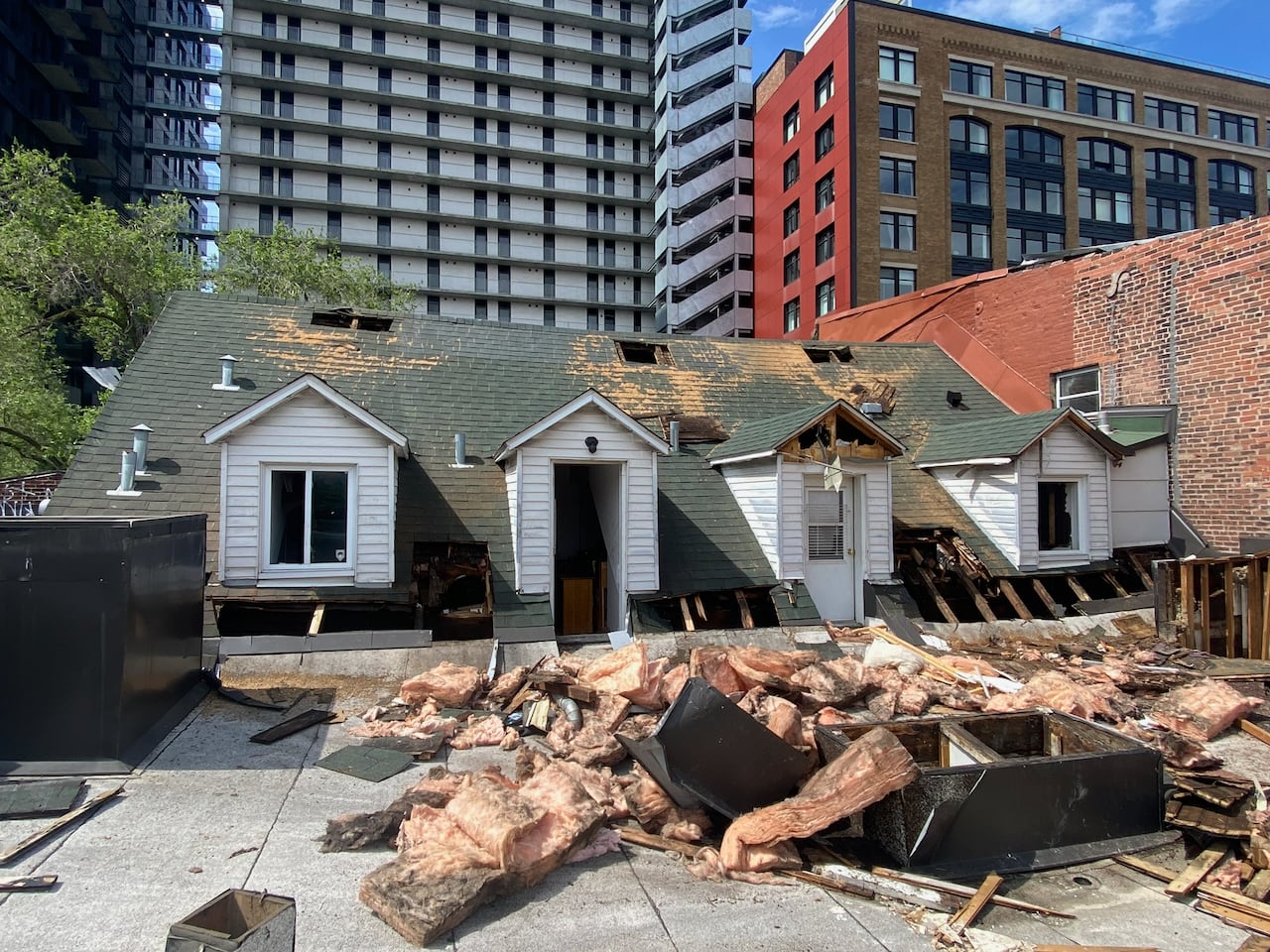 Charred insulation, wood, belonging on roof of building