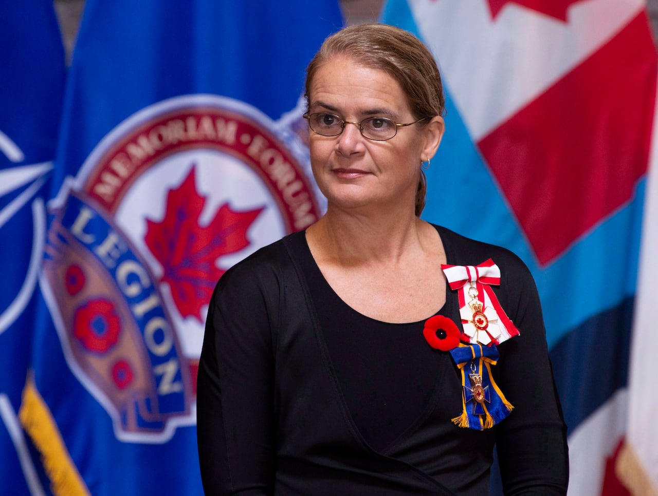Former govenror general takes part in a ceremony after being presented with the Legion's first poppy at the Beechwood National Memorial centre Monday, October 22, 2018 in Ottawa.