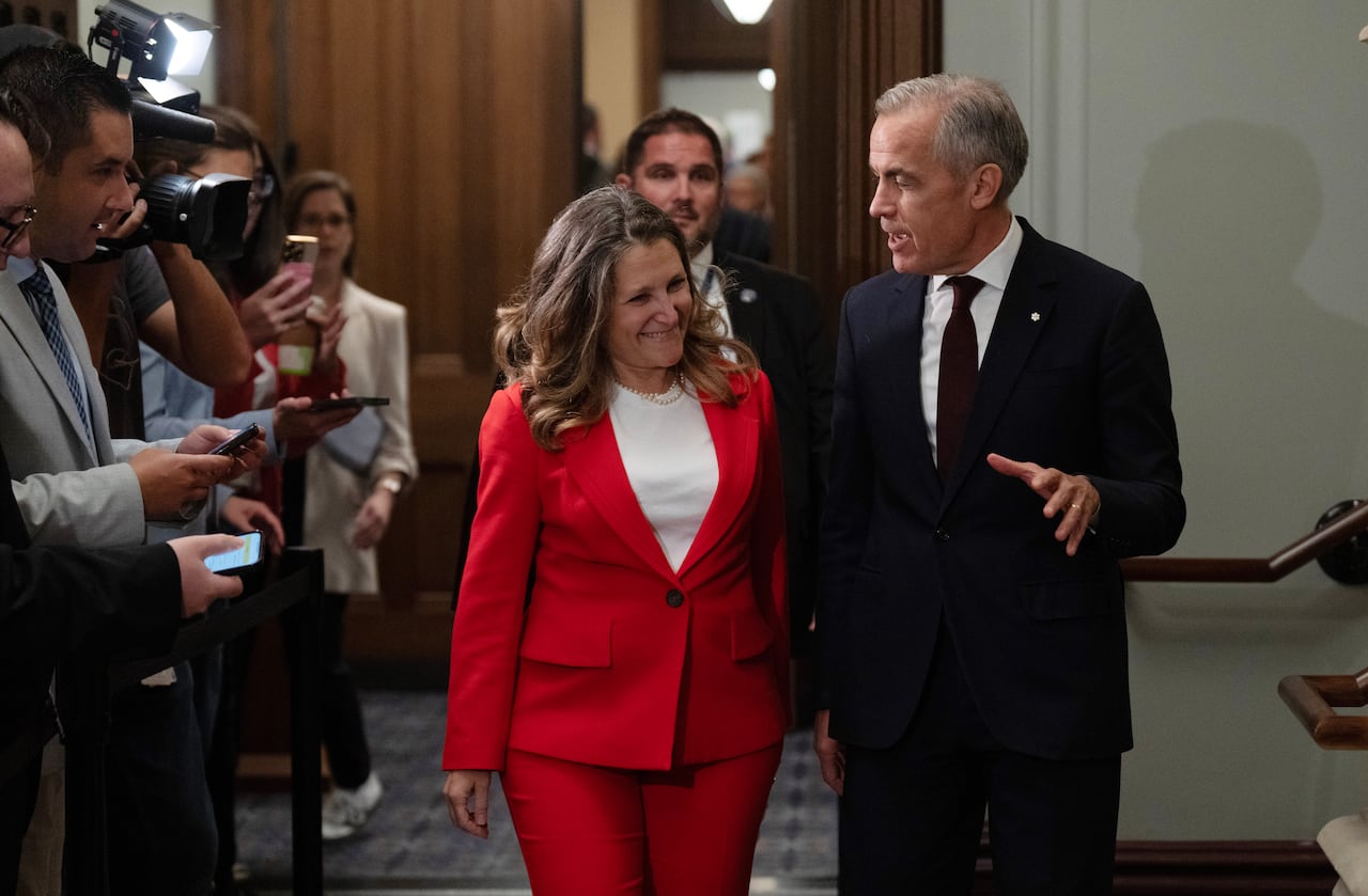 Prime Minister Mark Carney speaks with Minister of Transport and Internal Trade Chrystia Freeland