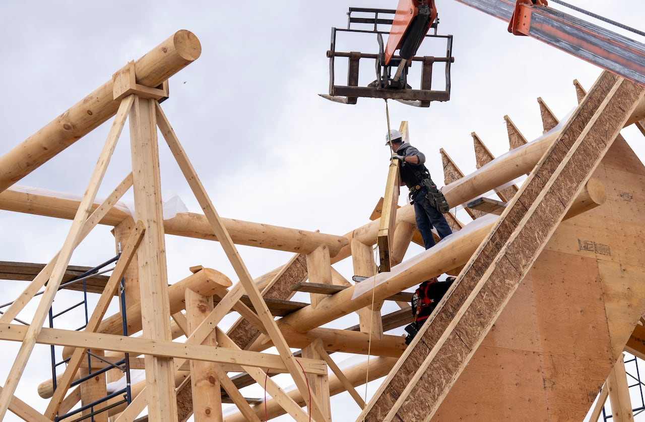 Carpenters build a log home