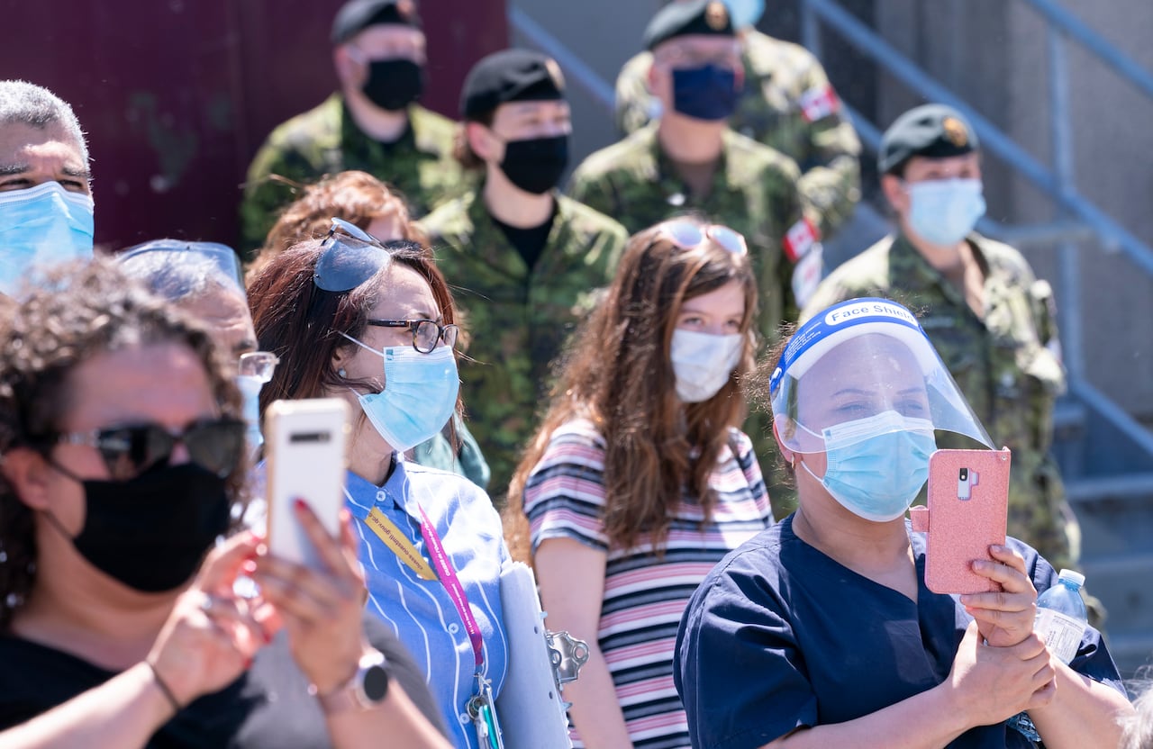 Staff members record a ceremony marking the last day of military presence at the CHSLD Nazaire-Piche in Montreal, on Wednesday, June 17, 2020.