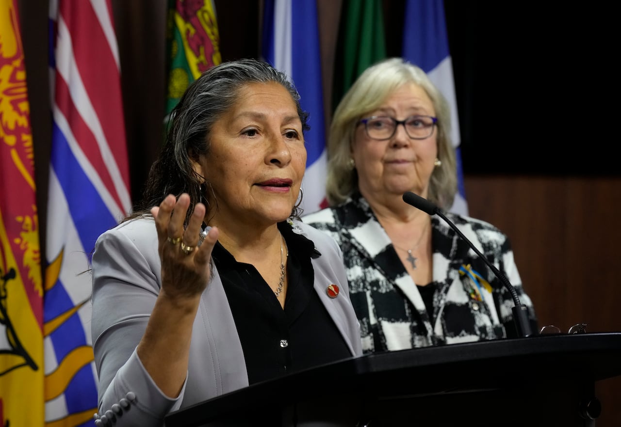 Green Party leader Elizabeth May looks on as Senator Rosa Galvez speaks during a news conference on Parliament Hill in Ottawa on Wednesday, June 17, 2026.