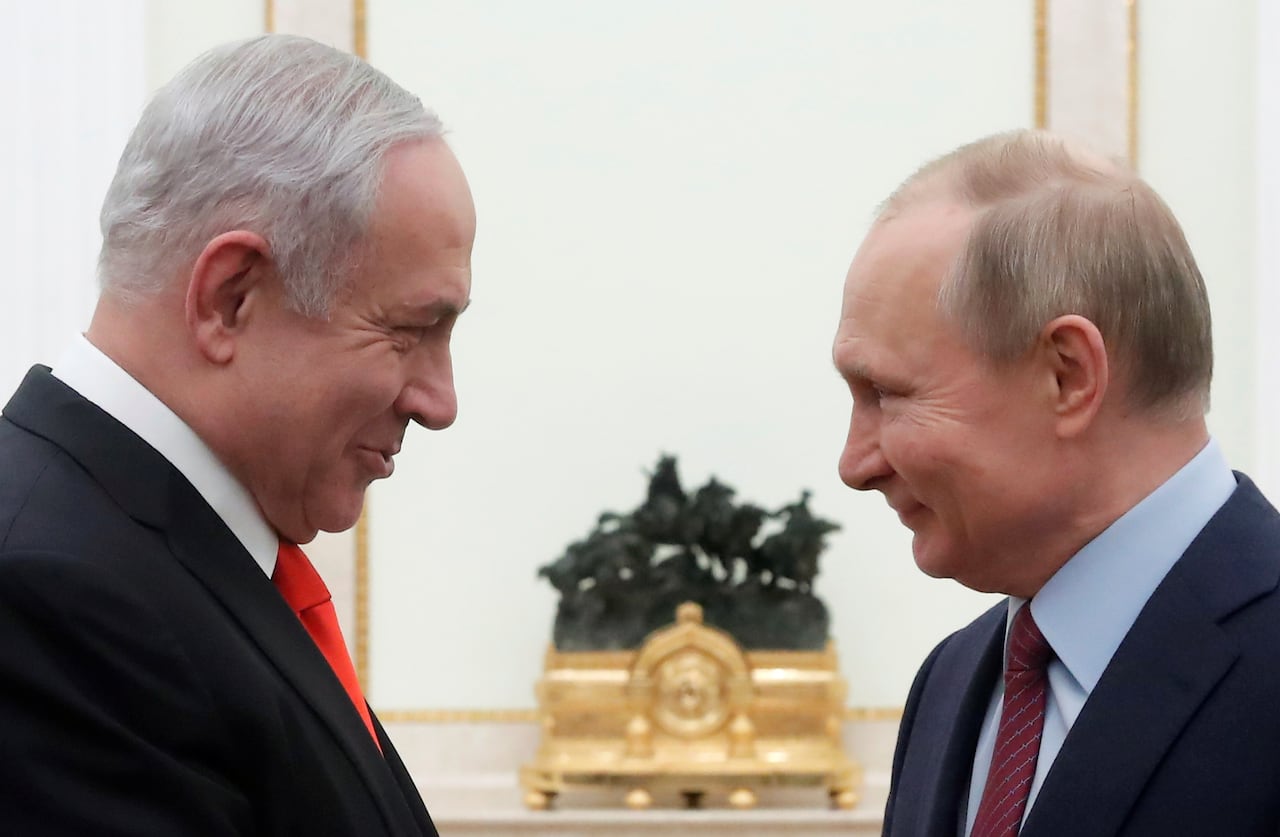 Two men face each other.