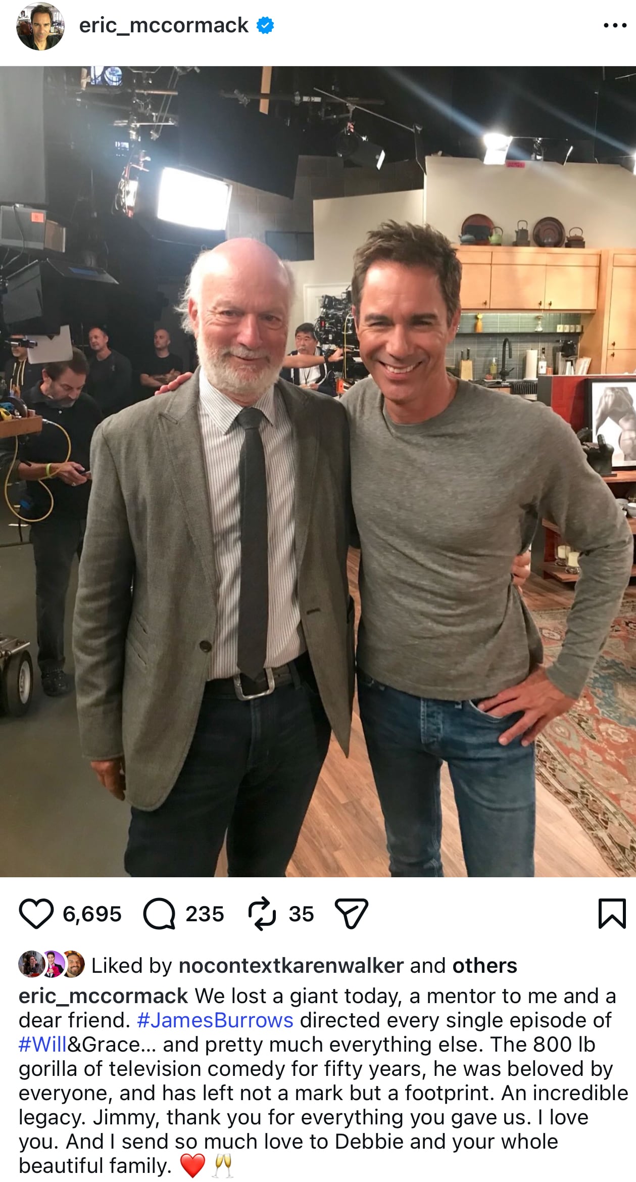 A social media post of two men standing, with their arms around each other's backs, on a TV show set.
