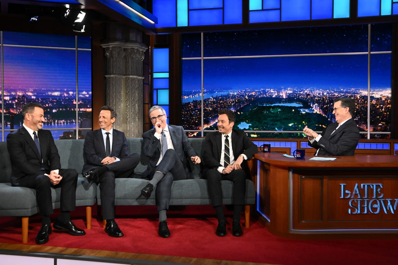 Host Stephen Colbert, right, with guests, from left,  Jimmy Kimmel, Jimmy Fallon, John Oliver, and Seth Meyers on "The Late Show with Stephen Colbert wearing suits