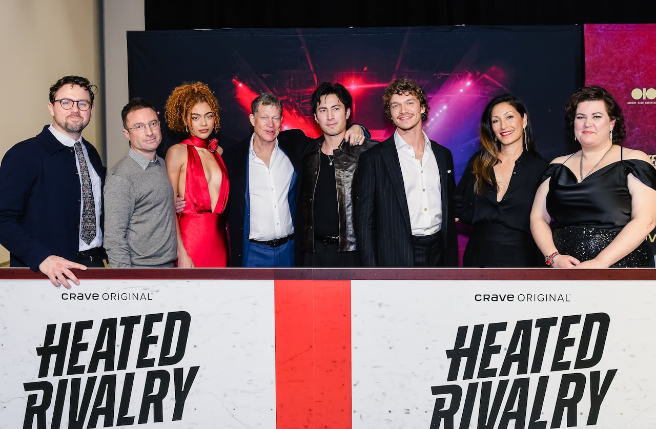 Cast of Heated Rivalry poses for cameras at the TIFF Lightbox.