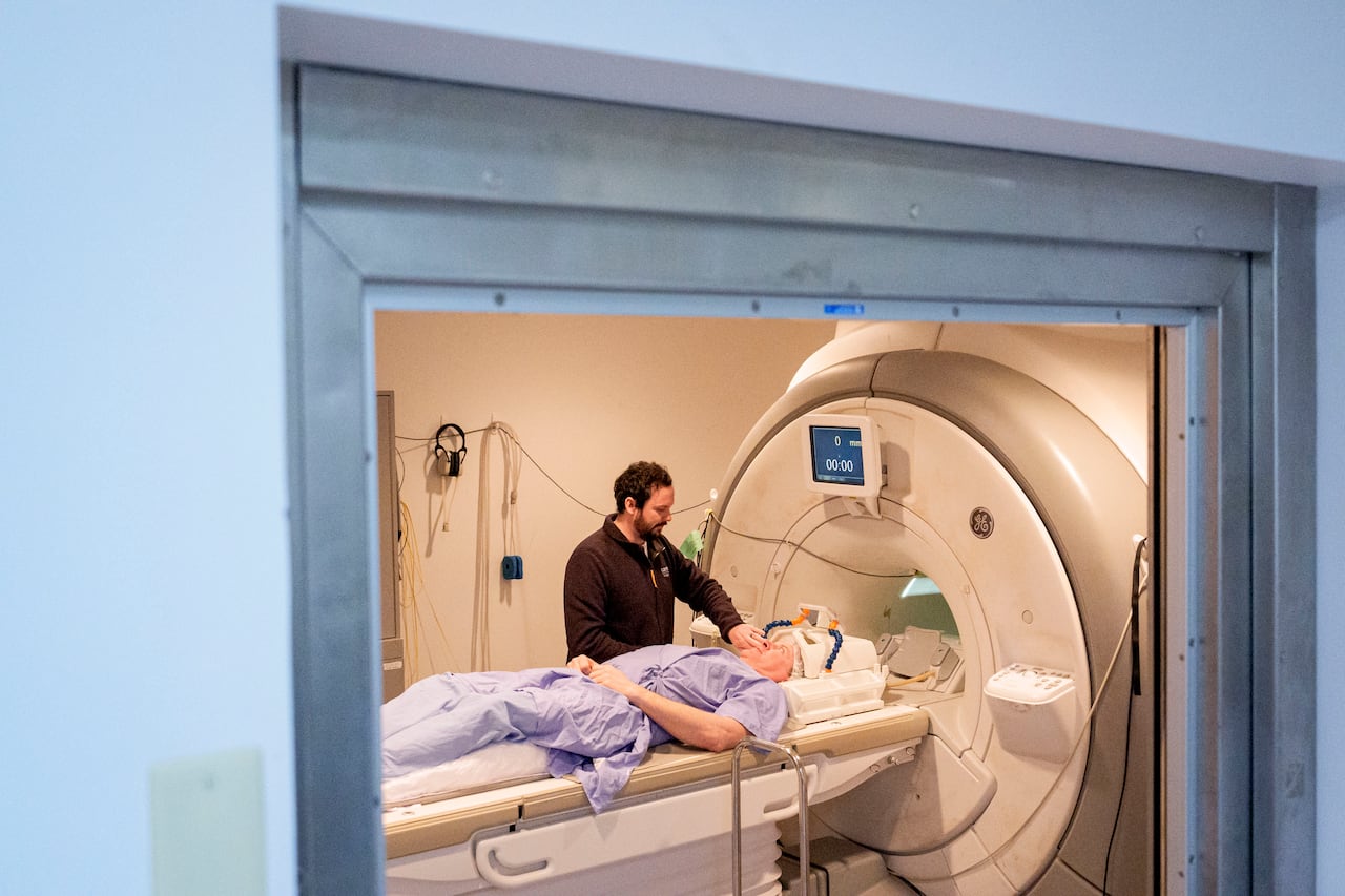 Technologist Andrew Rossall conducts an MRI scan on veteran Brendan Hynes at the Centre for Addiction and Mental Health.