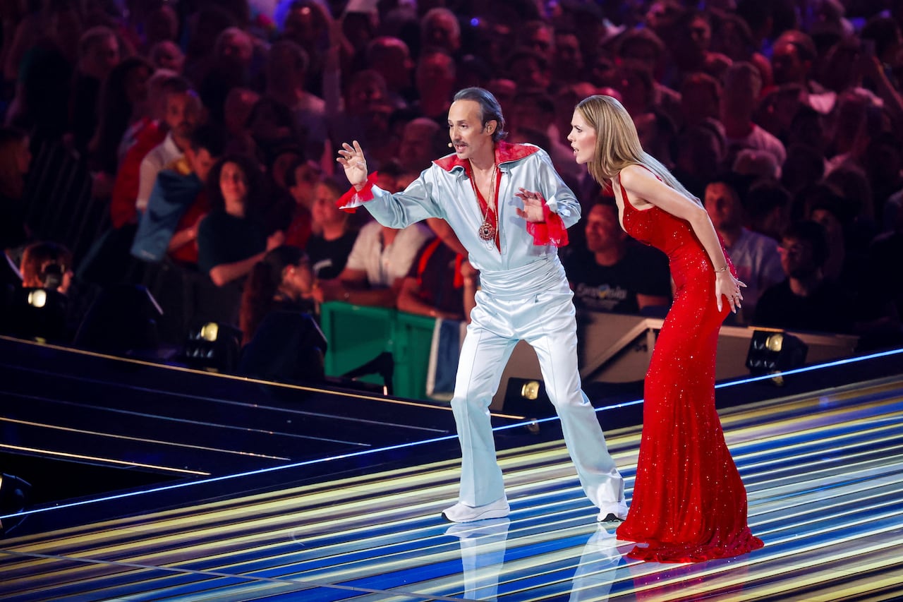 Hosts Victoria Swarovski and Michael Ostrowski perform during the first semi-final of the 2026 Eurovision Song Contest, in Vienna, Austria, May 12, 2026.