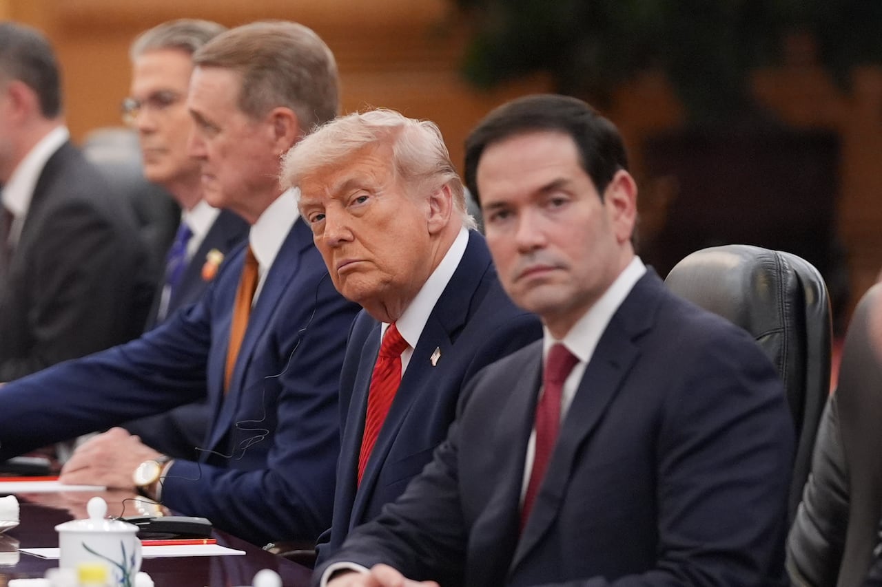 U.S. President Donald Trump sitting next to U.S. Secretary of State Marco Rubio while in the Great Hall of the People in Beijing, China.