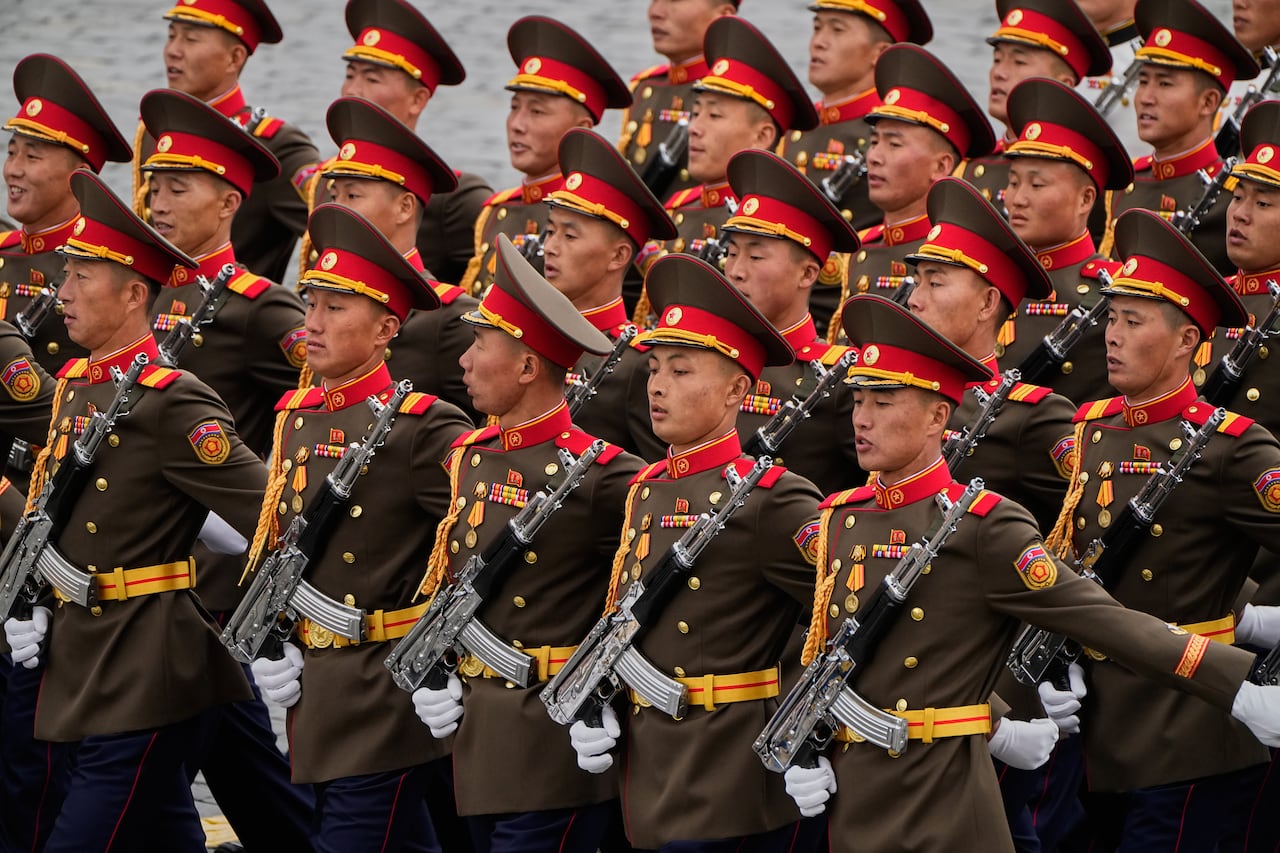Men in uniforms marching