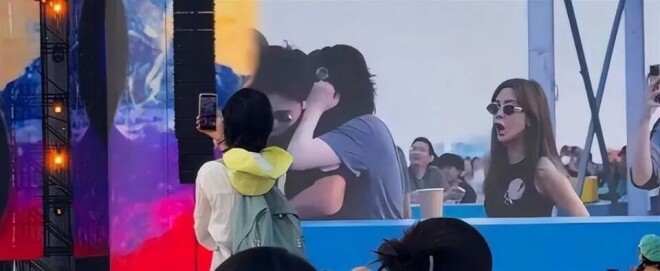 王菲躲镜头扑进黑衣男怀里 是陪了她16年的男人（配图7）