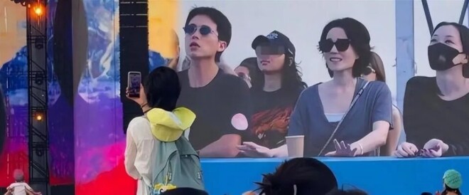 王菲躲镜头扑进黑衣男怀里 是陪了她16年的男人（配图3）