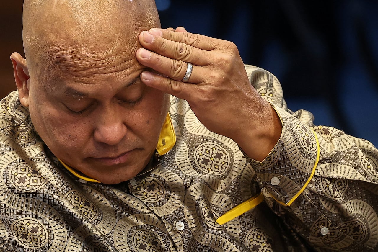 A man in a patterned shirt