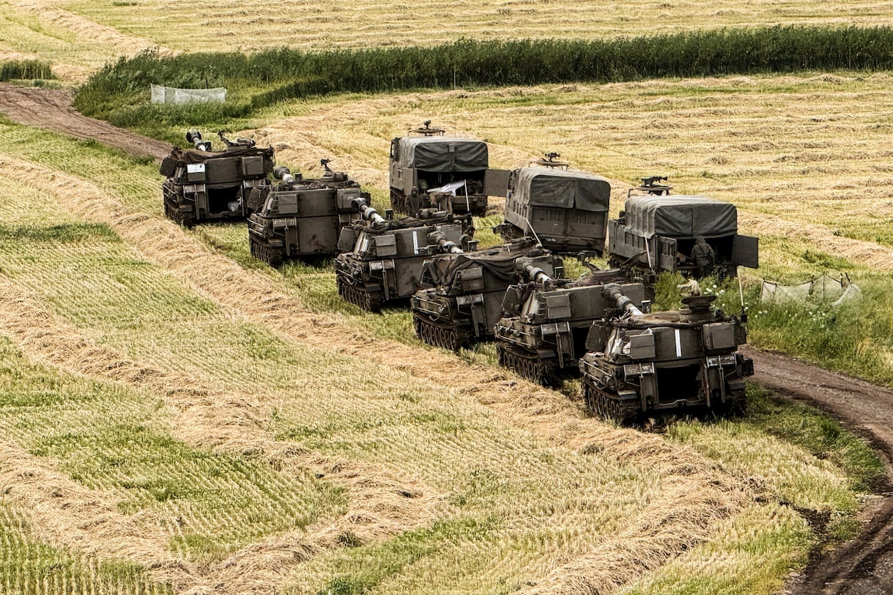 Israeli artillery units and military vehicles in formation on the Israeli side of the Israel-Lebanon border, in northern Israel May 4, 2026. Picture taken with a mobile phone.