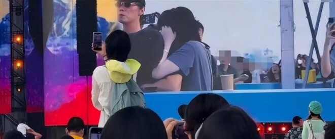 王菲躲镜头扑进黑衣男怀里 是陪了她16年的男人（配图5）