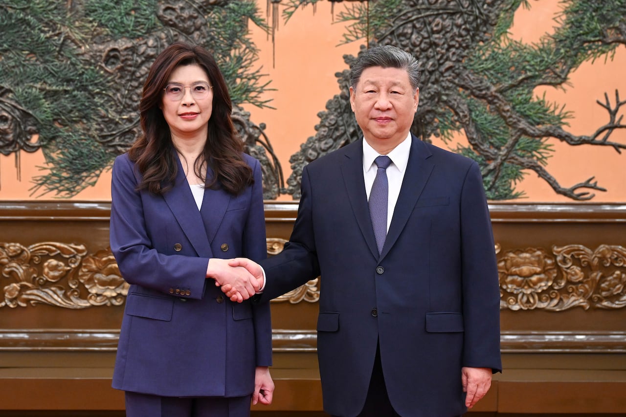 In this photo released by Xinhua News Agency, Chinese President Xi Jinping, right shakes hands with Kuomintang (KMT) party leader Cheng Li-wun in Beijing on Friday, April 10, 2026. ()