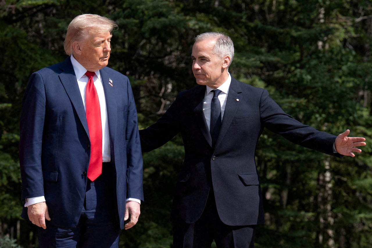 Two men in suits stand outside.