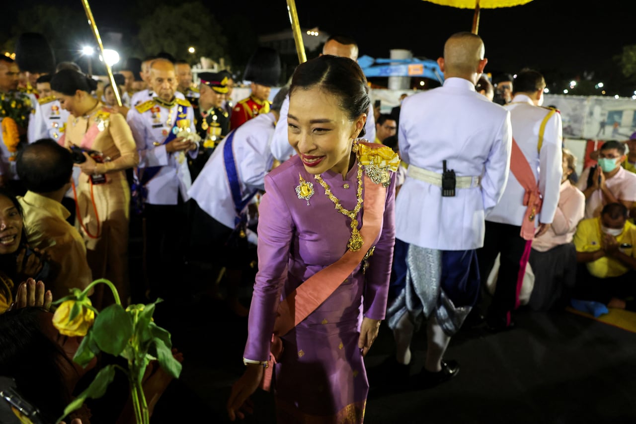 A princess greets a crowd of people.