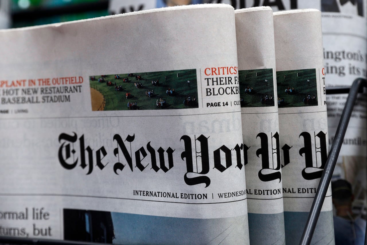 Newspapers are displayed.