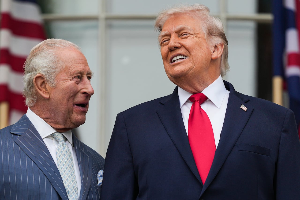 King Charles, left, and President Donald Trump, right, speak as troops march past during a State Visit arrival ceremony on the South Lawn of the White House, Tuesday, April 28, 2026, in Washington.