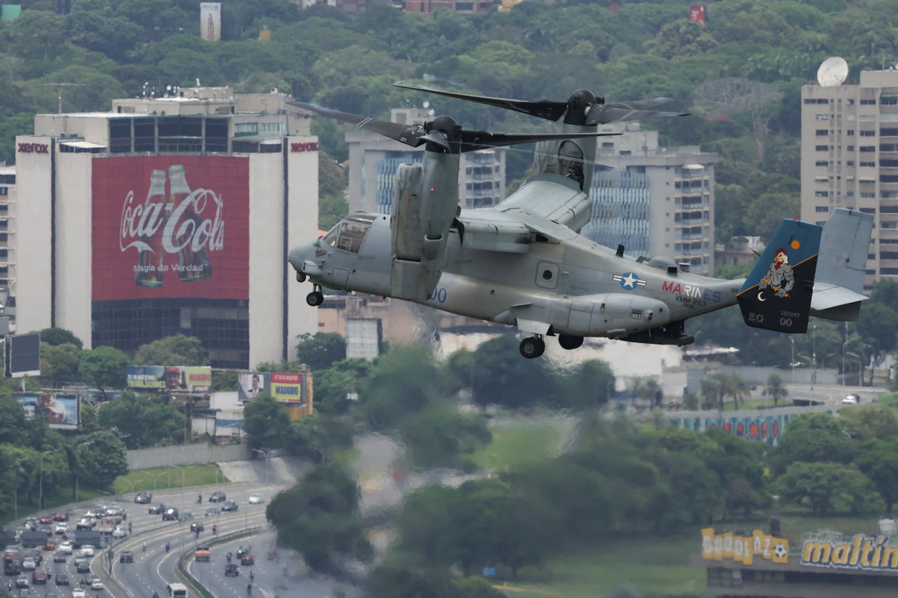 A U.S. military aircraft flying over a part of Caracas, Venezuela.