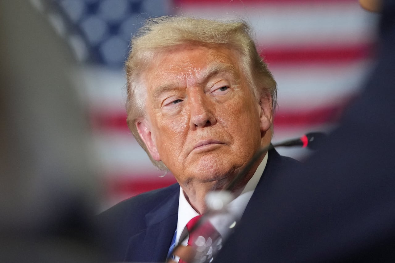 U.S. President Donald Trump looking to his side.