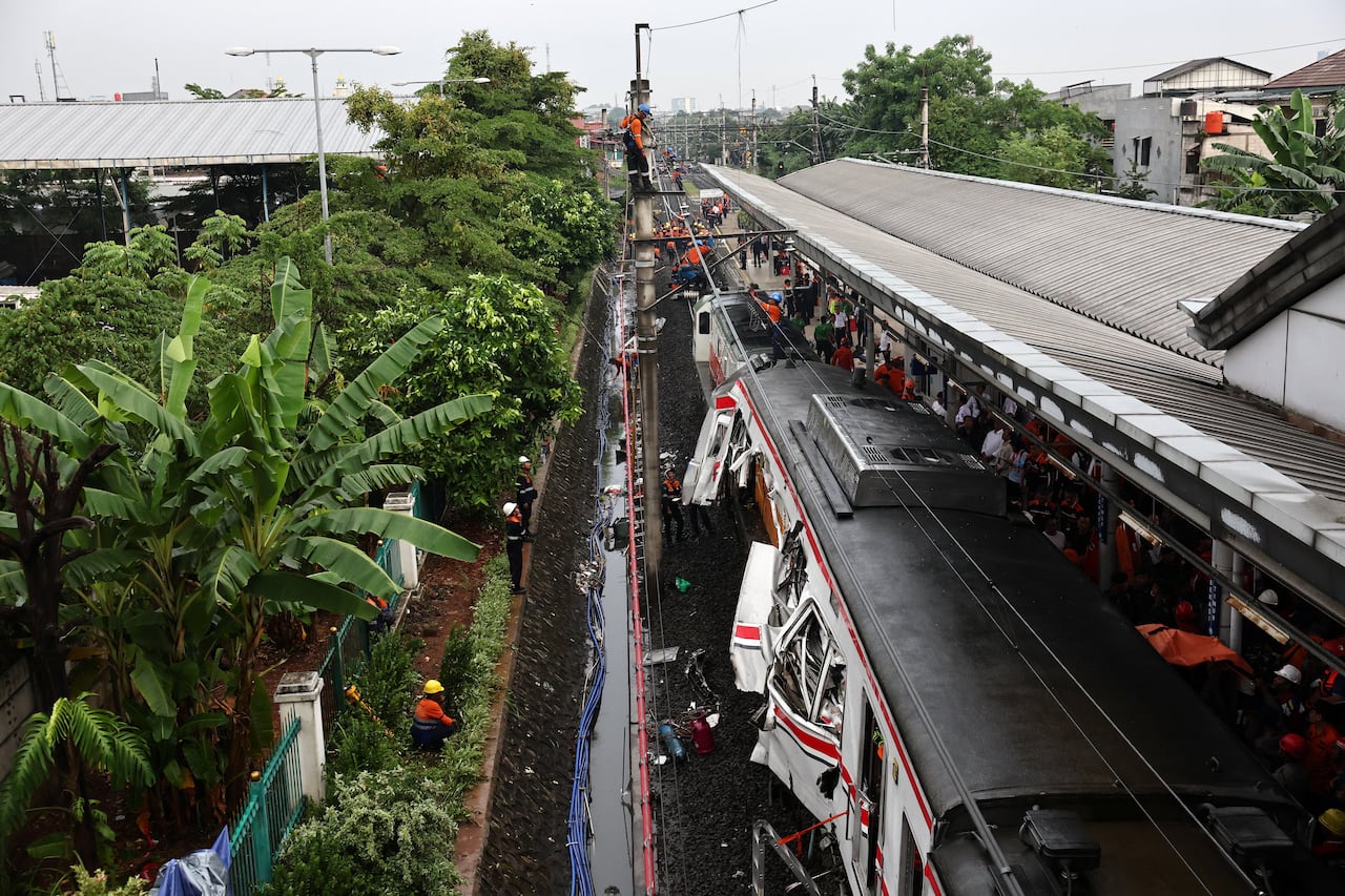 An overhead view of a badly damaged train after a collision with another train