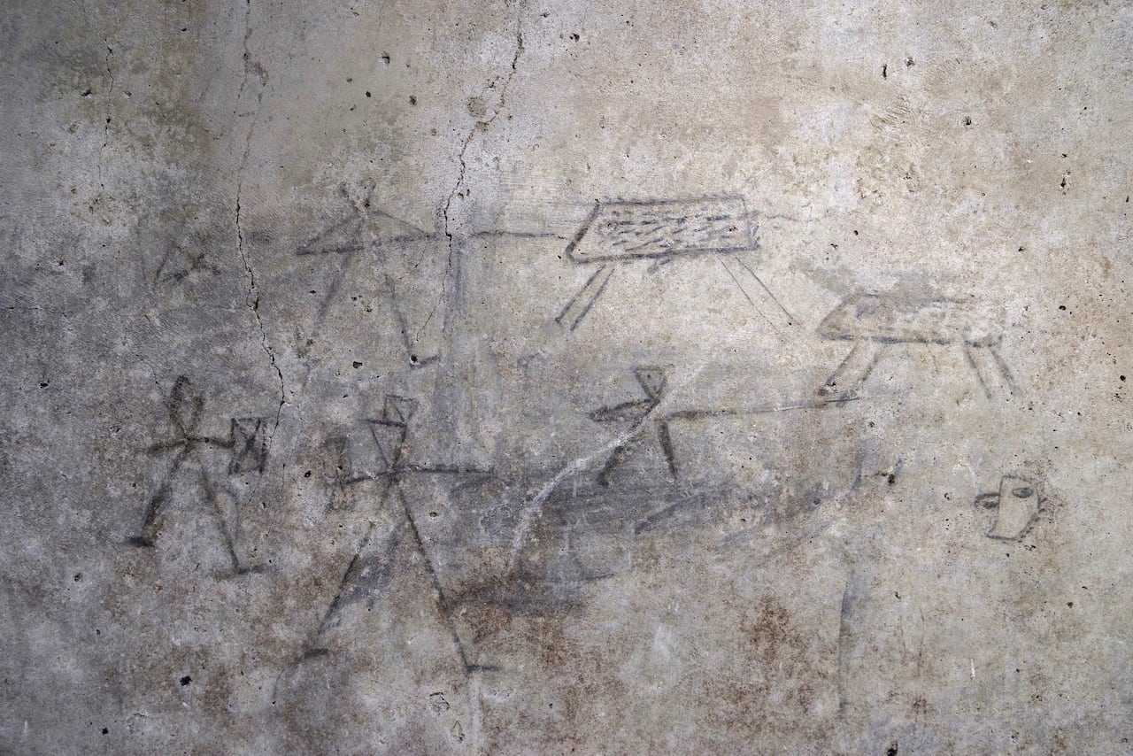 Stick figure drawings of gladiators and people hunting animals.