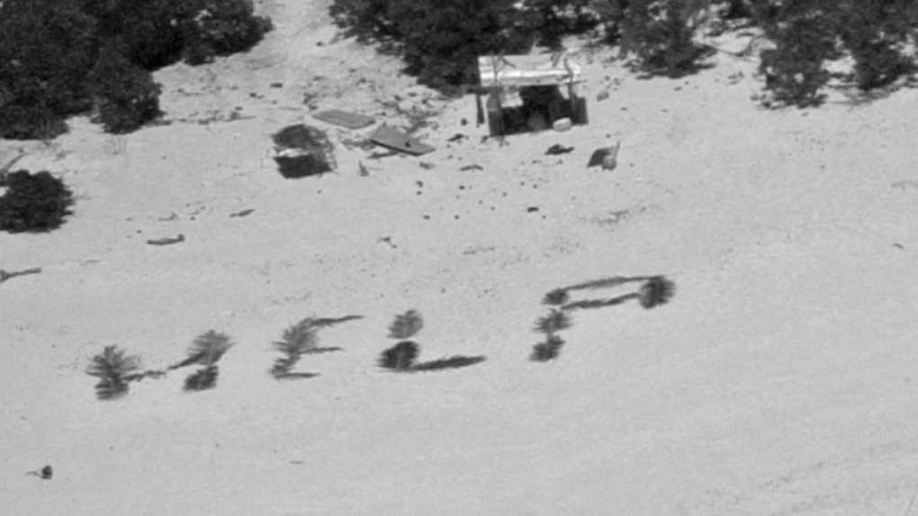 The crew of a Hawaii-based HC-130J Hercules aircraft makes contact with three mariners stranded on Pikelot Atoll, Yap State, Federated States of Micronesia, after dropping them a radio on April 8, 2024. (U.S. Coast Guard Forces Micronesia / Sector Guam)