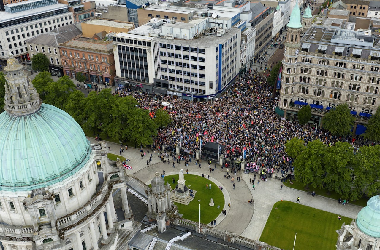 An aerial view shows protesters rallying in the street.