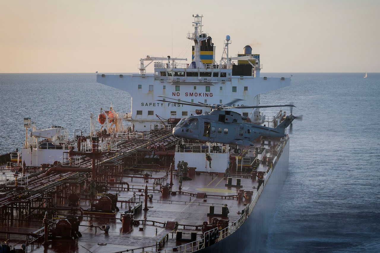 A photo showing U.K. Royal Marine Commandos detaining a sanctioned tanker in the English Channel.
