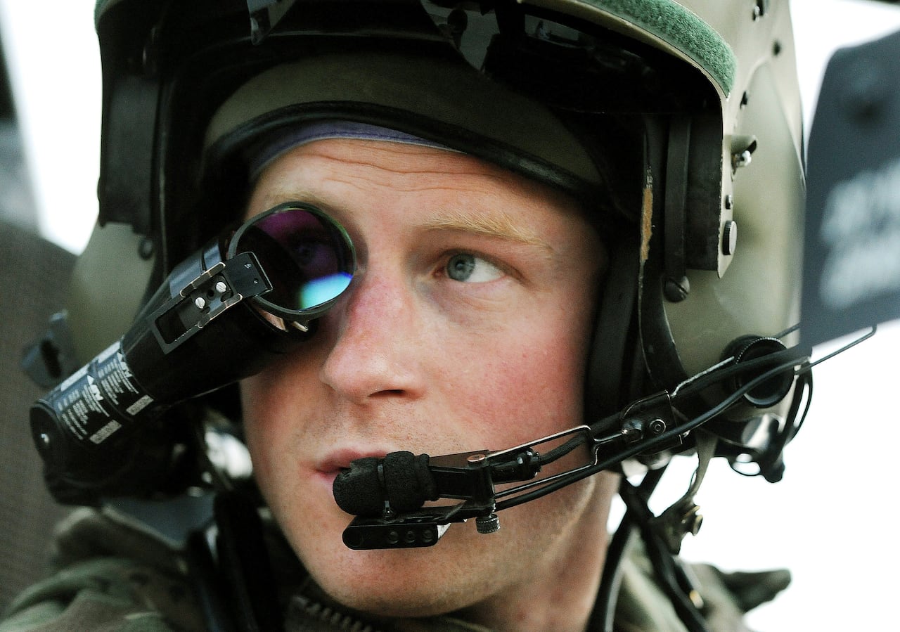 Prince Harry wears his monocle gun sight as he sits in the front seat of his cockpit at the British controlled flight-line in Camp Bastion southern Afghanistan.
