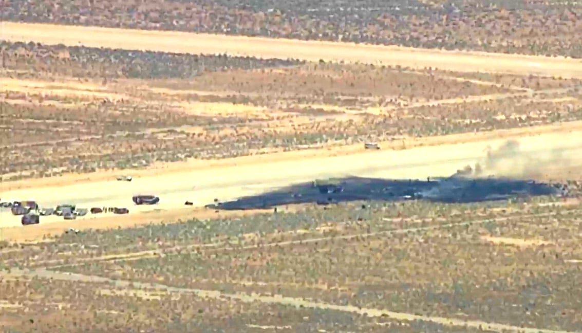 An image taken from KABC-provided video, showing law enforcement at scene of B-52 crash in California.