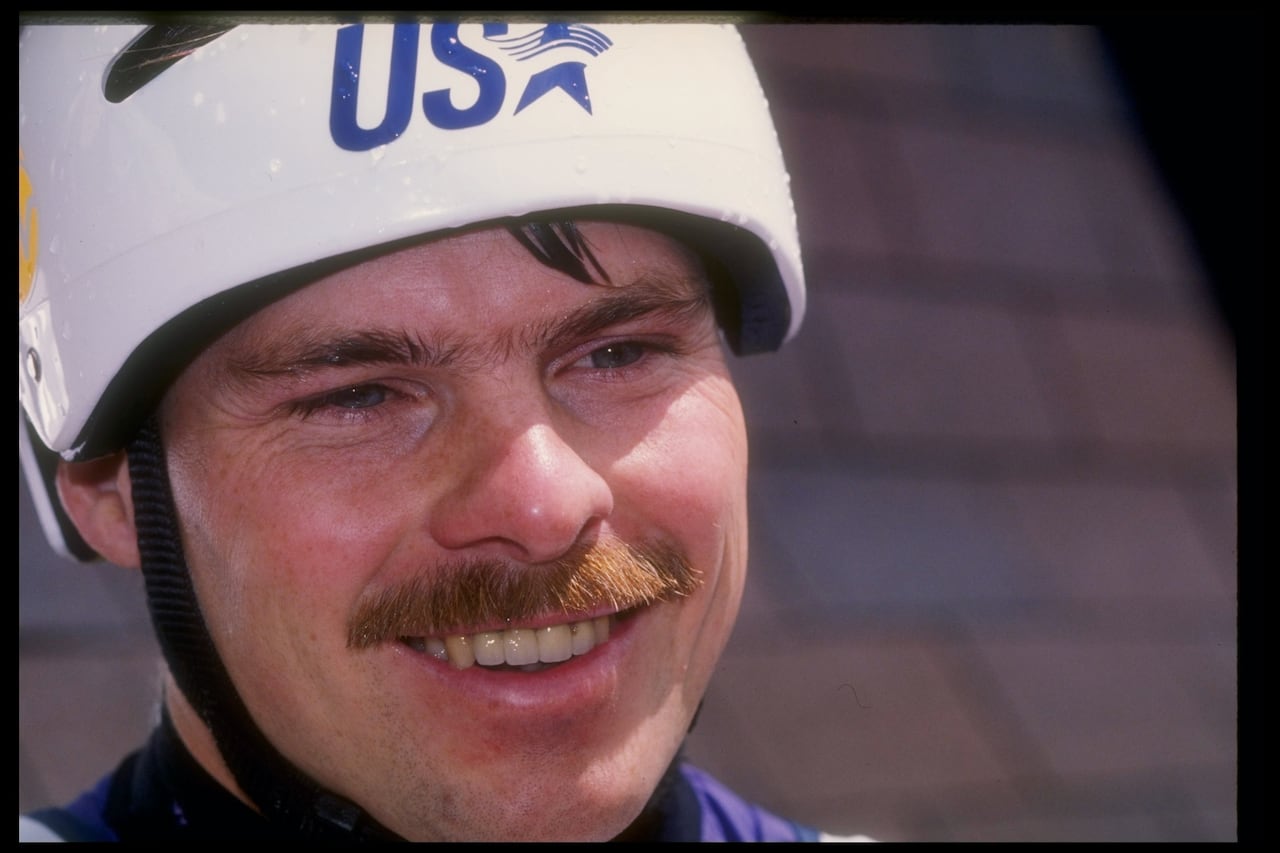 A person wearing a helmet is interviewed.