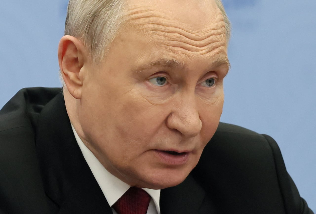 A close-up of the face of Russian President Vladimir Putin.