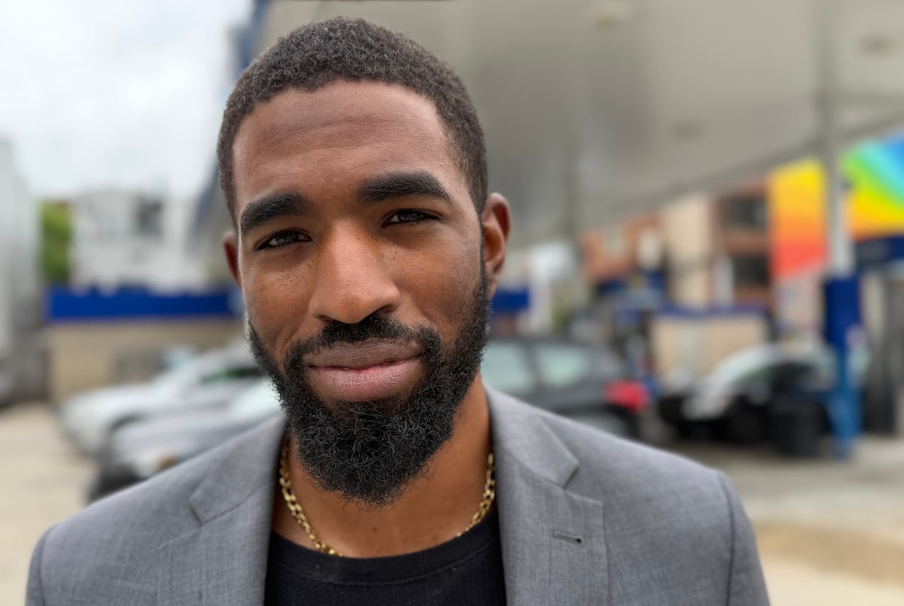 Photo of Oz Mangrum outside a gas station