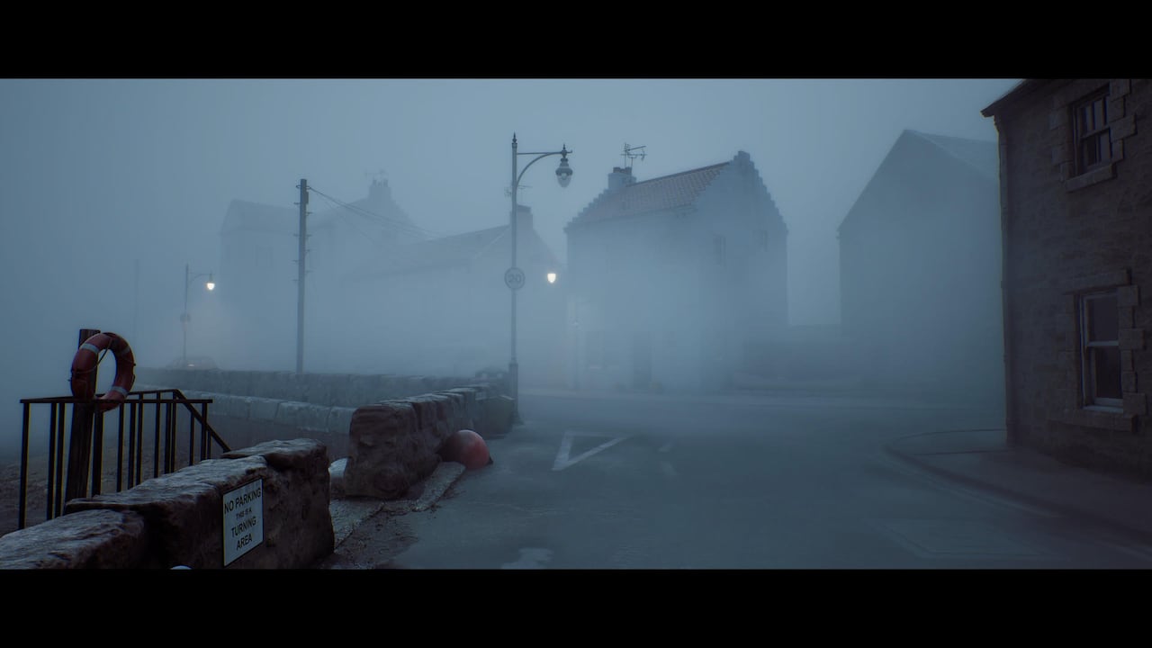 Video game screenshot of a Scottish town. The mist is obscuring several houses.