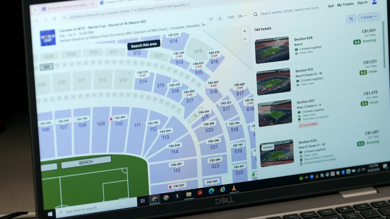 Close up of computer screen showing ticket prices for seats at a soccer game.