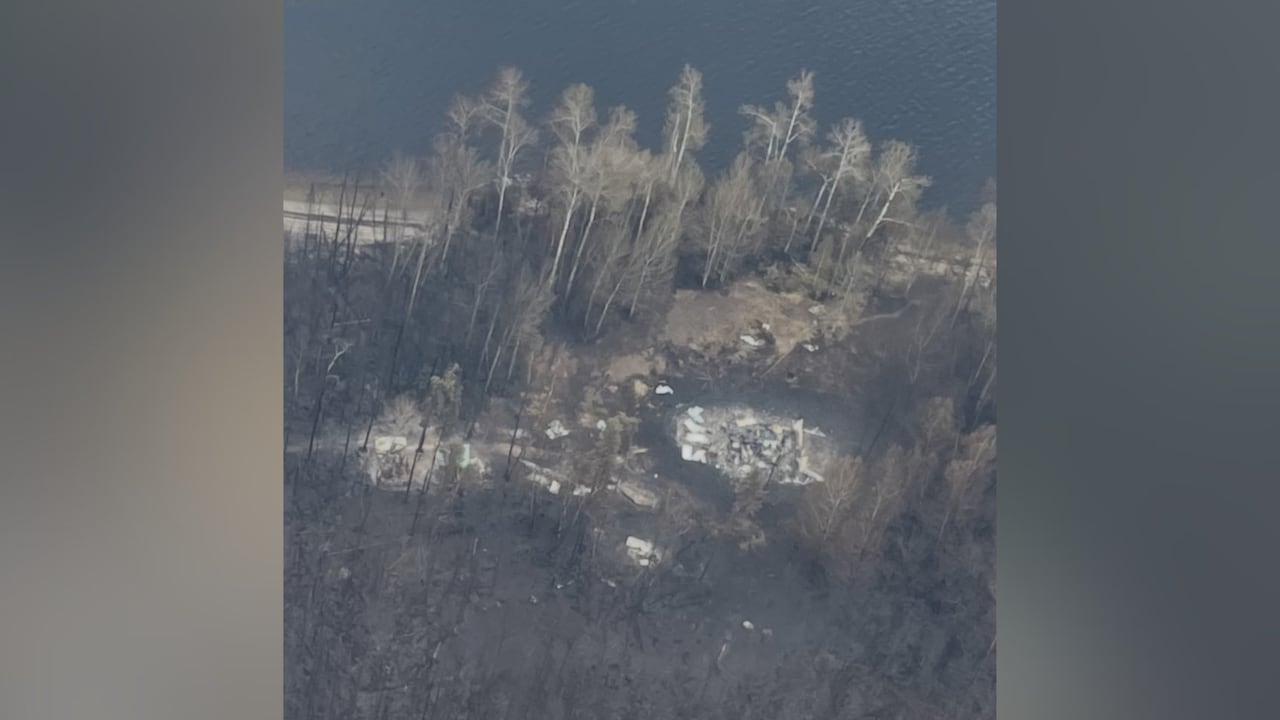 An aerial shot of a fire-ravaged community.