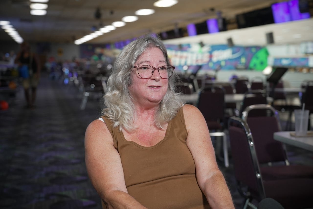 A woman in a bowling alley
