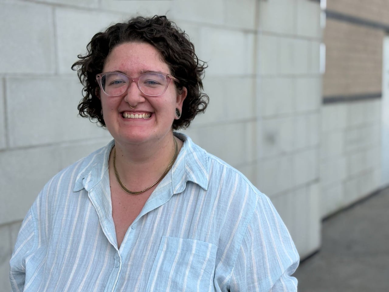 A woman smiling.