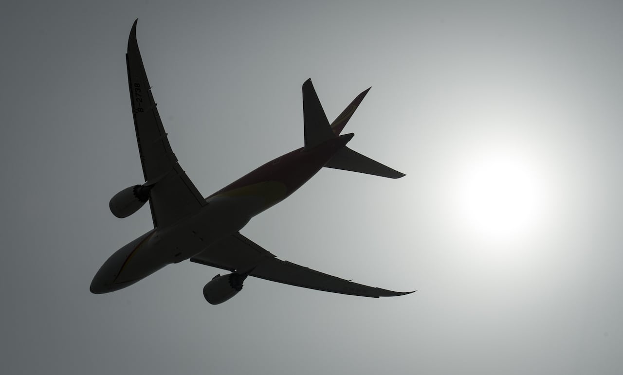 A plane flies through the skies.