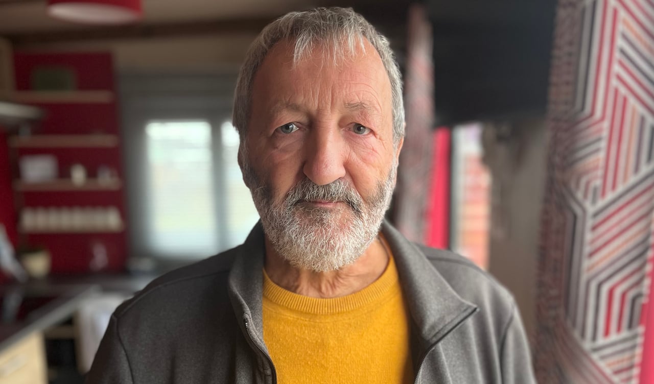 A man looks at the camera.